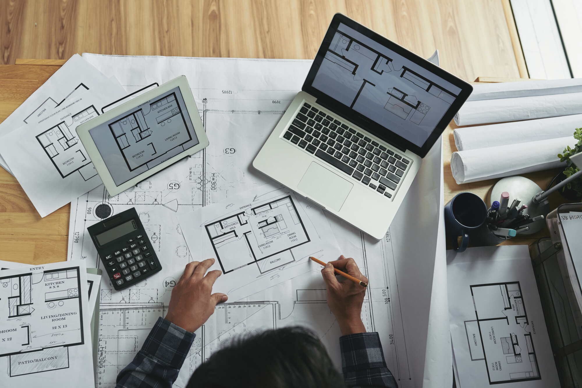 top view unrecognizable person making corrections blueprint sketch